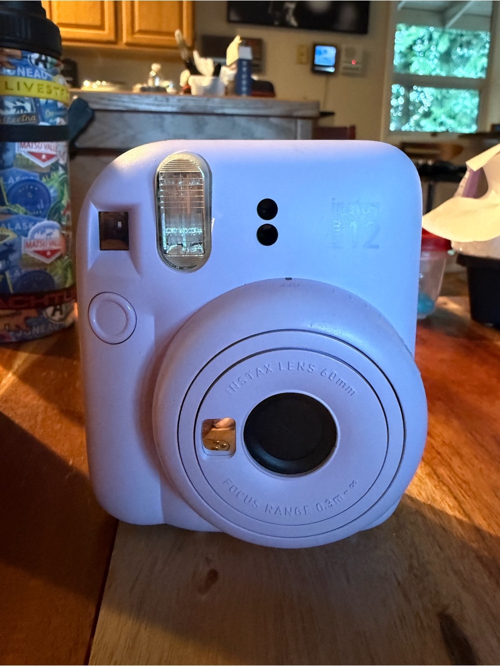 Fujifilm Instax Mini 12 Instant Camera - purple with full roll of film in it.